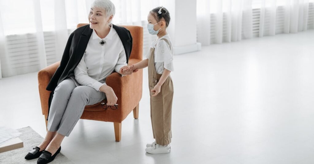 A social worker introduces herself to a child in a bright indoor setting, fostering a friendly interaction.